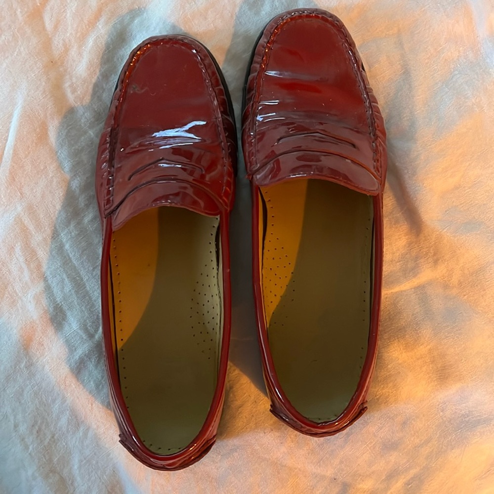 Cole Haan shiny red size 8 penny loafer style shoes.